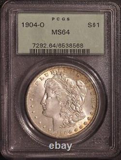 1904-O Morgan $ PCGS 64, Tonalité multicolore au revers, Avers éclatant avec ton de bord doré