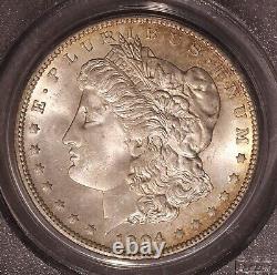 1904-O Morgan $ PCGS 64, Tonalité multicolore au revers, Avers éclatant avec ton de bord doré