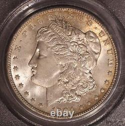 1904-O Morgan $ PCGS 64, Tonalité multicolore au revers, Avers éclatant avec ton de bord doré