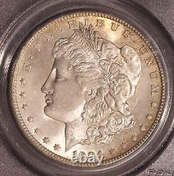 1904-O Morgan $ PCGS 64, Tonalité multicolore au revers, Avers éclatant avec ton de bord doré