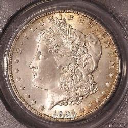 1904-O Morgan $ PCGS 64, Tonalité multicolore au revers, Avers éclatant avec ton de bord doré