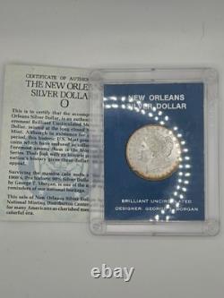 Dollar Morgan en argent 1884-O, plastique Capital à cœur bleu, BU non circulé, toning sur la tranche