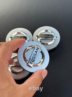 ENSEMBLE DE 4 CAPSULES DE CENTRE DE ROUES NISSAN Argent/Chrome 59 mm/2,32 pouces