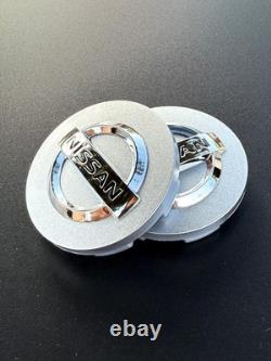 ENSEMBLE DE 4 CAPSULES DE CENTRE DE ROUES NISSAN Argent/Chrome 59 mm/2,32 pouces
