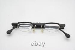 Lunettes vintage passe-partout sans monture demi-cerclée noire et argentée en verre