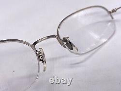Montures de lunettes Oliver Peoples pour femmes et hommes, ovales, argentées à demi-cerclage, style Harvard vintage.