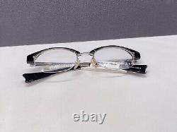 Montures de lunettes pour femme Alain Mikli Noir Argent Ovales Demi Cerclées M0203